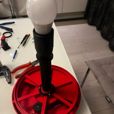 Overview of the red Dreamachine base, rotor, motor drive and stationary central lamp.