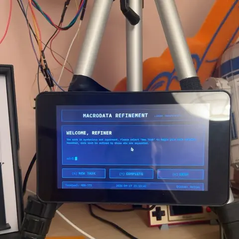 The original Raspberry Pi and display in their separate case